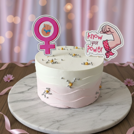 White cake with pink decorations on a marble stand against a pink curtain background FOR WOMENS DAY
